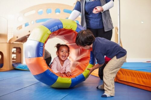 Kids exploring the gymboree play area at The Ripe Market - Academy Park in Dubai.