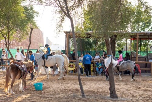 Kids doing horse riding at The Ripe Market - Academy Park Dubai