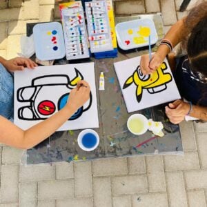Kids enjoying canvas painting at The Ripe Market - Academy Park Dubai