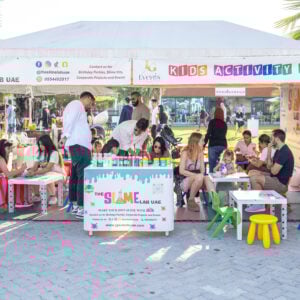 Visitors with their kids at the slime lab located at The Ripe Market - Academy Park in Dubai